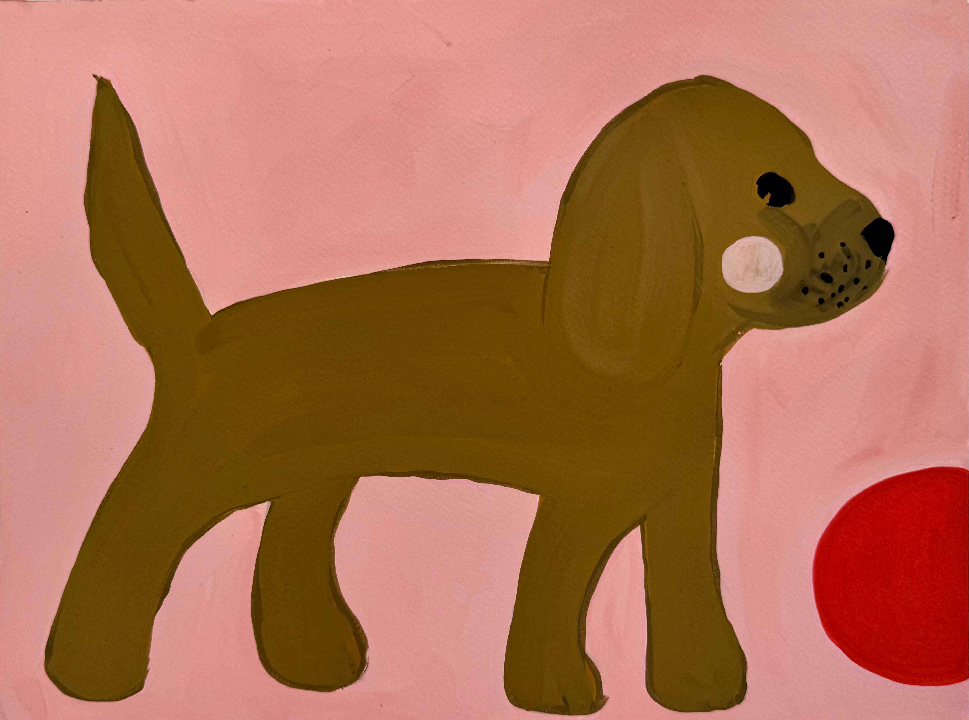 Hund med rød ball